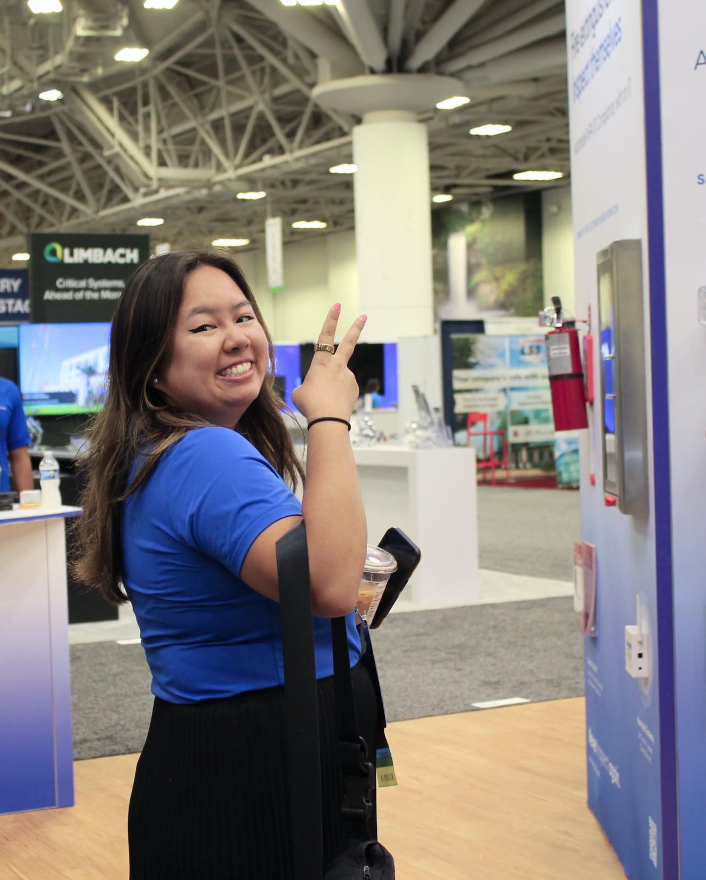 Attendee smiling at the Hexmodal booth