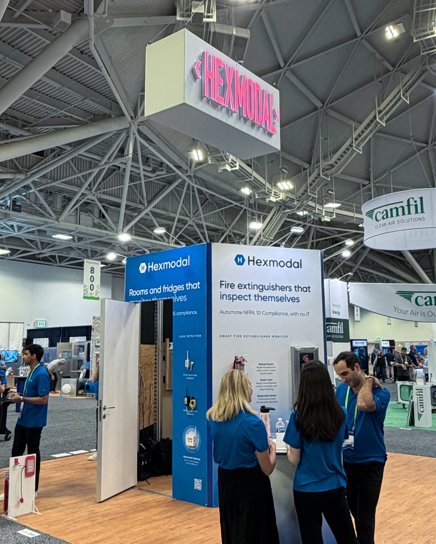 Hexmodal booth with its illuminated hanging sign on the ASHE HFIC show floor